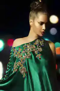 Bottle Green Formal Cape features beautiful embroidery on the bodice and sleeves. Concealed back zip closure. The dress comes with cigarette pants and a Matching dupatta.