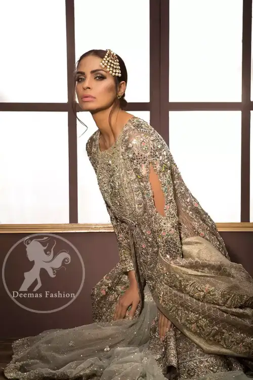 The shirt features beautiful and lovely embellishments that accentuate the neckline, all over the bodice, the front flared, and a