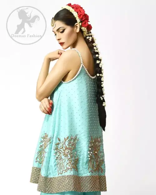 The frock has been adorned with a working border on the front and back hemline. Large embellished motifs are implemented