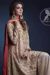 Light Fawn Aline Shirt – Palazzo Pants. The shirt has been adorned with an embroidered neckline. Work includes kora, dabka, stones, sequins, beads, silk threads, and Swarovski crystals.