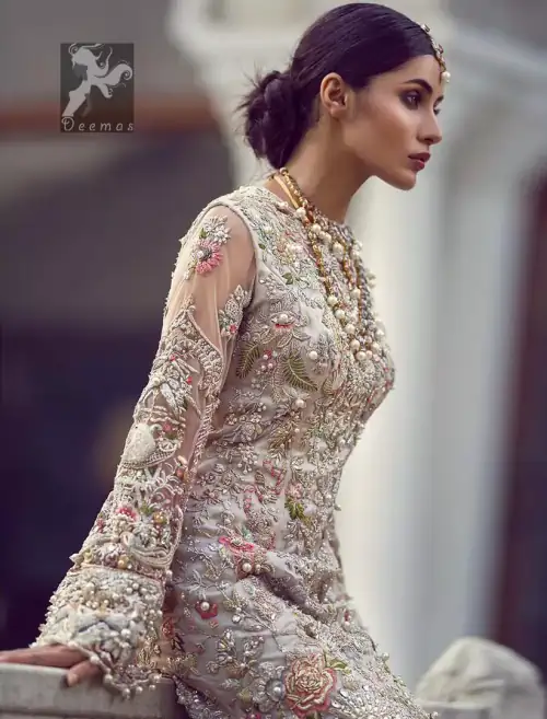 Ivory white long fitted bridal maxi. Maxi adorned with colorful embellishment using appliques and threads. Bridal maxi comes with two