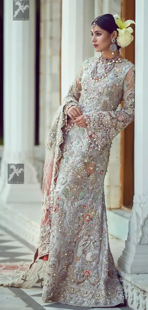 Ivory white long fitted bridal maxi. Maxi adorned with colorful embellishment using appliques and threads. Bridal maxi comes with two