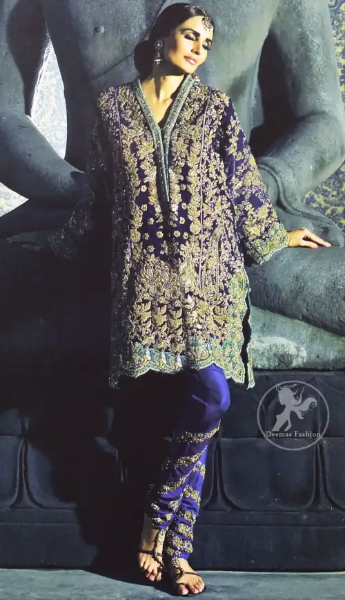 This classic shirt is reflecting exuberant colours. Kurta style shirt meticulously highlighted with antique kora, dabka, pearls and sequins. It