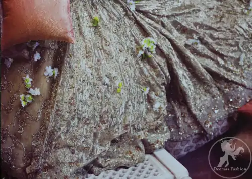 Redish brown exuberant velvety blouse is highlighted with moti, kora, dabka, pearls, swarovski, crystals, and sequins. This sleeveless blouse is