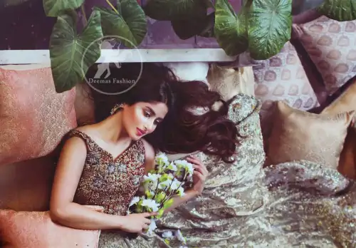 Redish brown exuberant velvety blouse is highlighted with moti, kora, dabka, pearls, swarovski, crystals, and sequins. This sleeveless blouse is