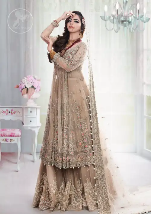 This outfit is meticulously featuring antique shades of kora, dabka, tilla, sequins and pearls. This dress is beautifully sculptured with