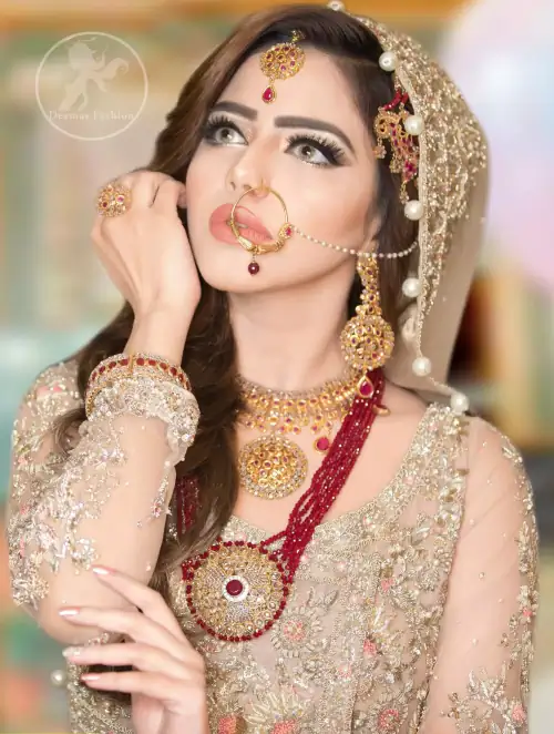 This dress is beautifully sculptured with floral embroidery. Angrakha is decorated with tassels which adds to the look.