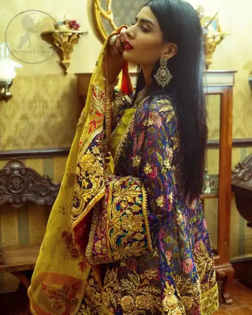 This royal blue angrakha shirt is embellished with resham thread. It is meticulously highlighted with dull golden kora dabka, tilla,