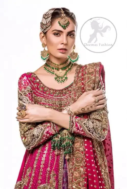 This bridal dress is adorned with floral embroidery.It is meticulously highlighted with dull golden and antique shaded kora, dabka, tilla,