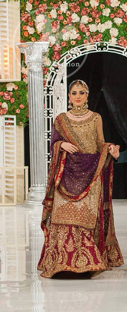 This bridal dress is perfect for your special day. Exude elegance in this chiffon shirt finessed with beautiful embellished daman and neckline, done with antique shaded kora dabka, tilla, sequins and pearls. Lehenga comprises of floral embroidery adorned with thick embellished border. It comes with purple dupatta with embroidered borders on all sides and sequins spray on the ground.