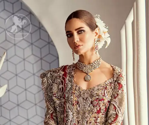 Look alluring in this floor length frock embellished with kora dabka, tilla, swarovsky and pearls. It has intricate embroidered motifs