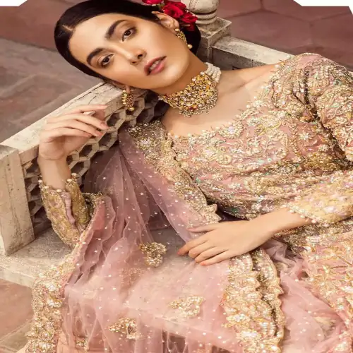 The grand gold bridal stands out due to its uniqueness and the perfect fusion of modern cut and traditional embroidery.