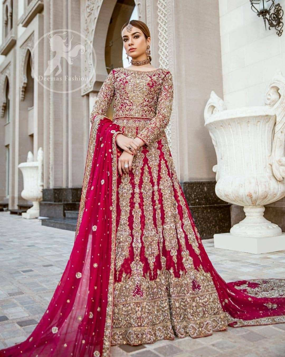 Delicately crafted and personifying chic elegance with an element of grandiose. Heavily embellished in the front with intricate embroidered pattern done with dull golden kora, dabka, kundan, tilla and sequins. The lehnga with embroidered motifs pattern all over and finished with thick kora and dabka borders completes the look. It is coordinated with tissue dupatta which is sprinkled with sequins all over it. It is further furnished with four sided embroidered border.