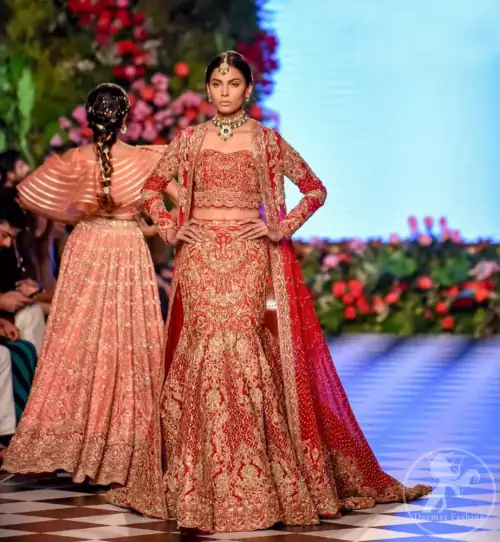 This dress is beautifully decorated with heavy embroidery. It is highlighted with dull golden kora, dabka, tilla, sequins and pearls.