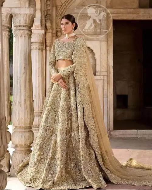 The grand gold bridal stands out due to its uniqueness and the perfect fusion of modern cut and traditional embroidery.
