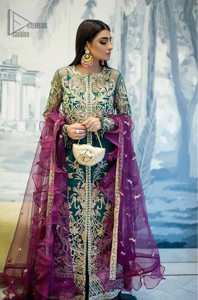  Modern yet traditional. Boost your confidence and style in this glamorous attire accentuated with finest thread work and zardosi embroidery. The outfit is beautifully sculptured with colorful embellishment and finessed with beautiful embellished applique hemline. Having full sleeves with scalloped finishing. The outfit is coordinated with crushed sharara and magenta dupatta adorned with four sided lace border and frill.
