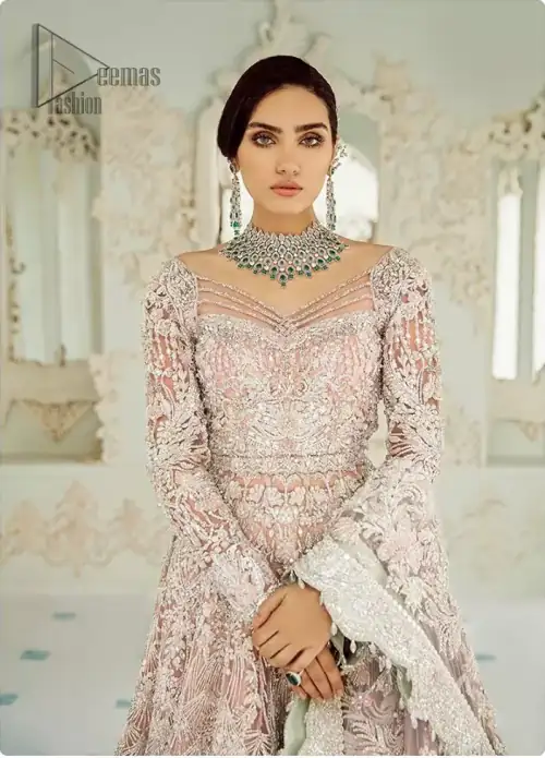 An example of beauty and elegance. Look breathtakingly stylish in this embroidered regalia furnished with intricate embroidered neckline. This ethereal