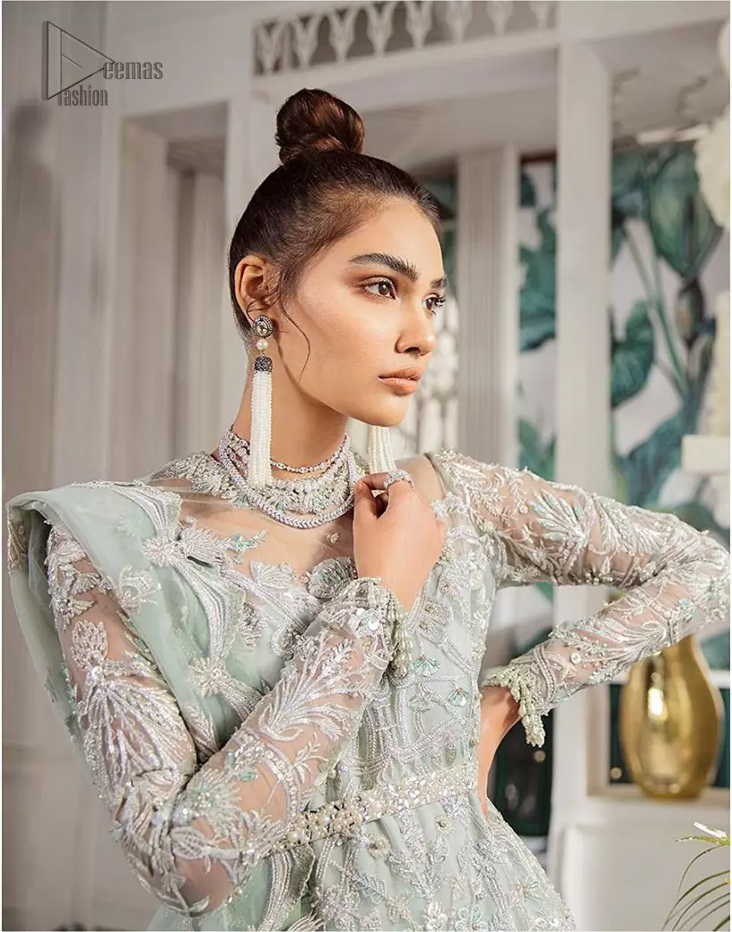 Delicately crafted and personifying chic elegance with an element of grandiose. This outfit is aesthetically designed with motifs and floral patterns, embellished with kora, dabka, nakshi, sequins, cutdana and  crystals. The detailed scalp border gives a perfect ending to this peplum. Beautifully designed sleeves is an amalgamation of floral design elements. Sharara comprises of sequins spray all over. The dupatta incorporates beautifully designed scalloped borders on all four sides and tiny floral motifs.