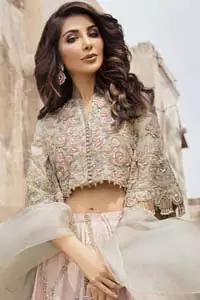 This artisanal piece is rendered in grace and timelessness. An example of beauty and elegance. Look breathtakingly stylish in this embroidered regalia furnished with intricate embroidered blouse and scalp third quarter bell sleeves. It comprises with gradient lehenga having light pink and mint green colors done with zardozi floral bootis and a thick embellished bottom. Style it up with mint green organza dupatta.