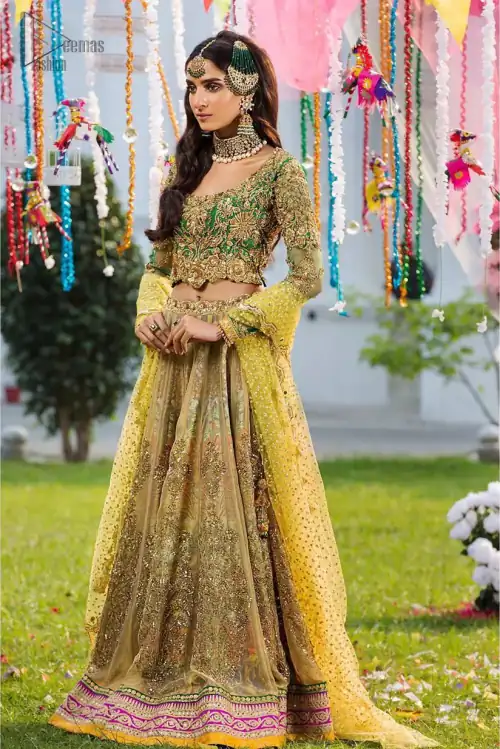 A perfectly pretty combination for a mehndi function. Gussy up the glamour with this intricate embroidered blouse accentuated with golden