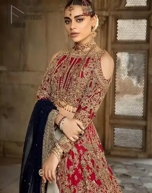 A breathtaking red traditional lehenga  paired with a detailed blouse, equally alluring make for an ensemble which is comfortably chic.