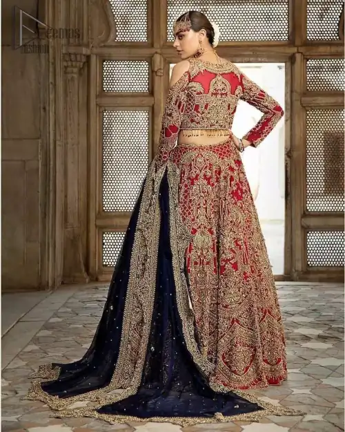 A breathtaking red traditional lehenga  paired with a detailed blouse, equally alluring make for an ensemble which is comfortably chic.