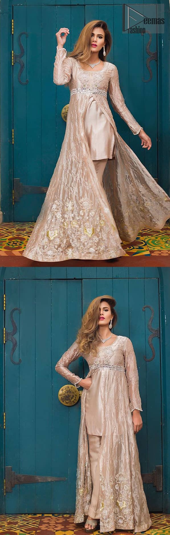 This dress is majestic beauty. Delicately crafted and personifying chic elegance with an element of grandiose. The gown is beautifully decorated with floral bunches done with silver kora, dabka, tilla and sequins work. The bottom of the gown is enhanced with rich floral embroidery. Style it up with hand embellished fixed waist belt. It comprises with cameo straight pantsa. This outfit is coordinated with chiffon dupatta having sequins spray all over.