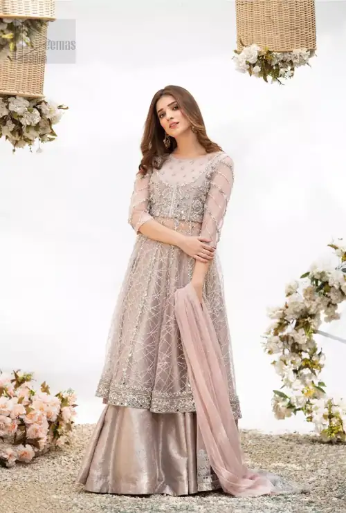 Embrace the season of festivities with this beautiful dress. Dazzle in this made to perfection, richly embroidered net outfit decorated
