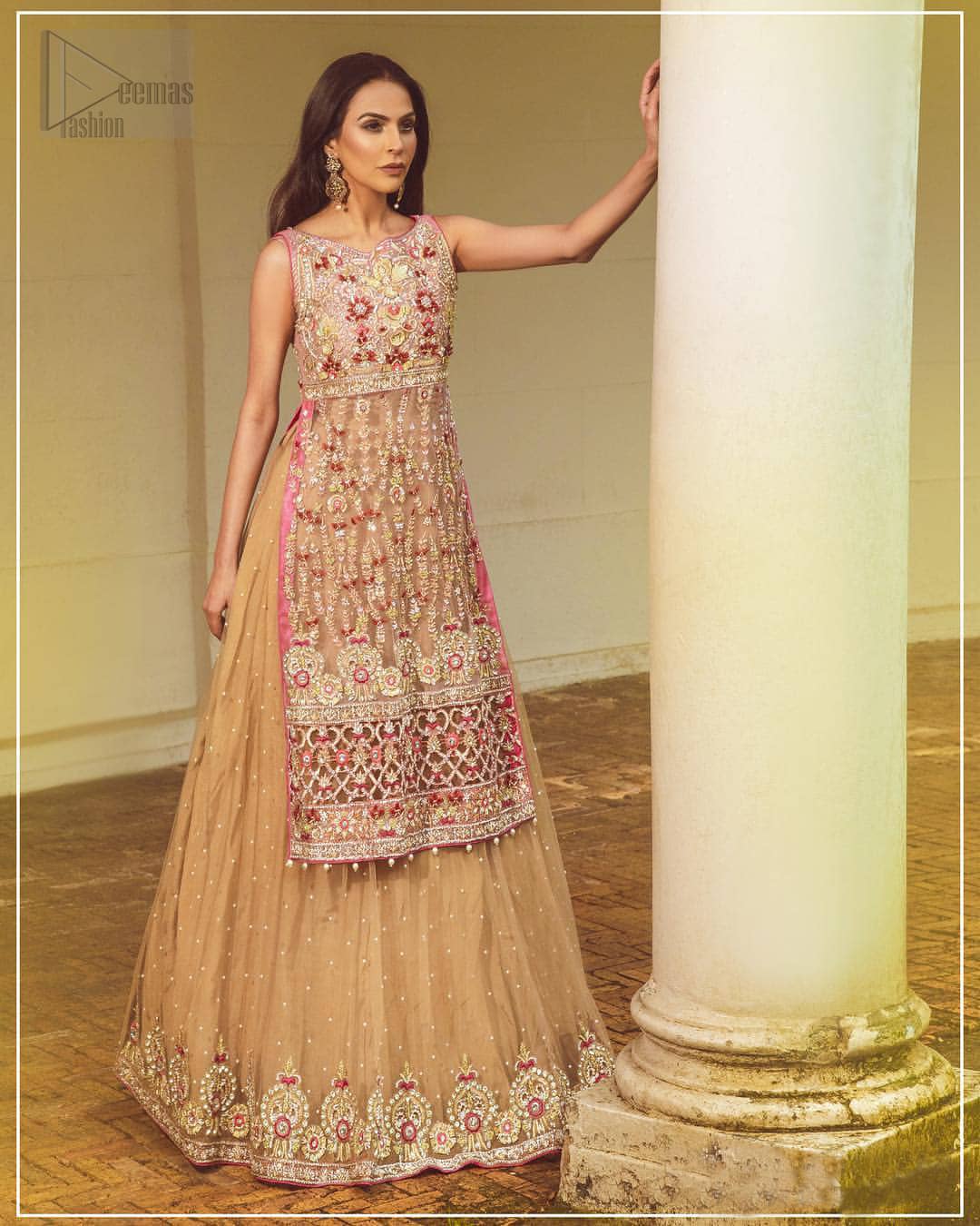 Steal the show with this endearing chiffon outfit with intricate yet rich embroidery. Crafted artfully with detailed multiple color thread embroidery on the bodice and traditional finessed work with kora, dabka, tilla and sequins. Hemline is intricately done with cut work and dangling balls, rest of the shirt is enhanced with floral bunches. Pair it up with fawn lehenga emphasized with different sized circular embroidered motifs at the bottom done with zardozi work to gave it a perfect look. Pair it up with fawn dupatta having four sided embellished borders and sprinkled with sequins all over the ground.
