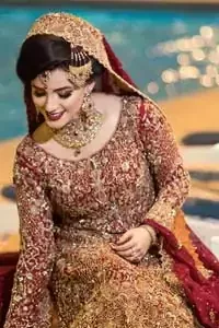 You are all set to make a lasting impact with the divine royalty of this dress. This ravishing ensemble is sure to make you look like glamorous royalty with immaculate work covering every inch of the shirt. It boasts a pretty scallop hemline and full sleeves with zardozi embellishment. Compliment the look with flared lehenga. The combination of rust with maroon is absolutely breathetaking. Elegance is personified when it gets paired up with an all-over sequins spray on dupatta dupatta with alternating scalloped borders detailing. This is an ensemble that deserves to be flaunted.