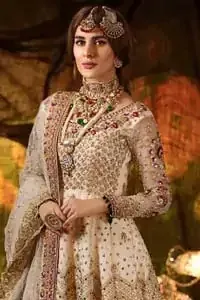 Delicately crafted and personifying chic elegance with an element of grandiose. This outfit is beautifully sculptured with geometric embroidery, adorned with heavy embellished bottom with golden and antique shaded kora, dabka, pearl and sequins work all over. Furthermore the outfit is emphasized with colorful thread work and mukesh embroidery. It is coordinated with ivory dupatta with sequins sprayed all over it along with zardozi work all around the edges to make the look complete.