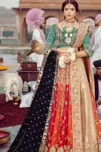Classic, timeless and truly beautiful, our bridal dress is perfect for your unforgettable day. Excellence of craftsmanship is evident with intricate detailing that features the use of zardozi work. The blouse is beautifully adorned with geometric patterns and floral embroidery with golden zardozi work and finished with dangling beads. Complete the look with artfully coordinated lehenga which is ornamented with a bold and captivating design with a traditional intricate embroidery and scattered tiny floral motifs. The combination of red and orange for lehenga is also captivating. Elegance is personified when it gets paired up with golden dupatta having four sided embroidered border.