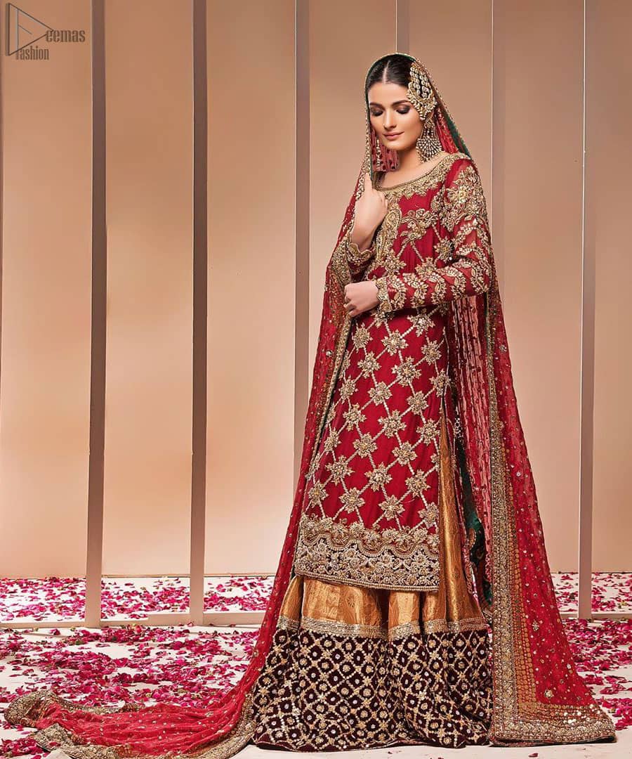 This style-savvy bride totally pulled off our classic bridal wear with an unmatchable grace and giving major bridal goals. The lehenga colour is the perfect feminine and delicate shade with its meticulously crafted fabrication with geometrically embellished border filled with gorgeous tiny floral motifs in it. The shirt is beautifully ornamented with geometrically arranged motifs and intricate details at the bottom. The zardozi embroidery is done in the shade of tan. Pair it up with maroon organza dupatta adorned with sterling sequences and four-sided embellished borders to give it a regal look.