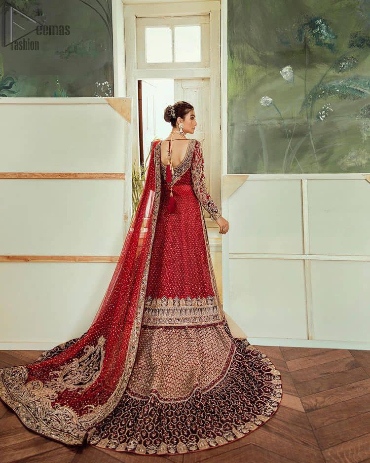 Deep red jacket gown having inner velvet blouse with maroon back train lehenga and heavily embroidered dupatta.