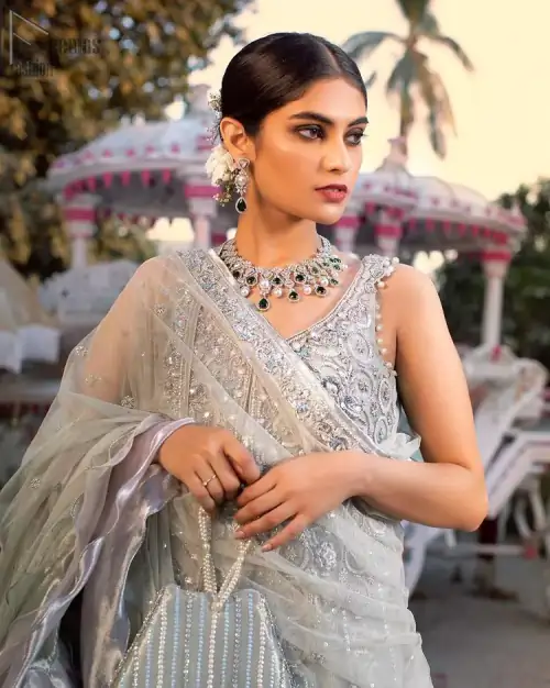 Light gray pure banarsi jamawar blouse, lehenga with front open long jacket having multiple layered frill.