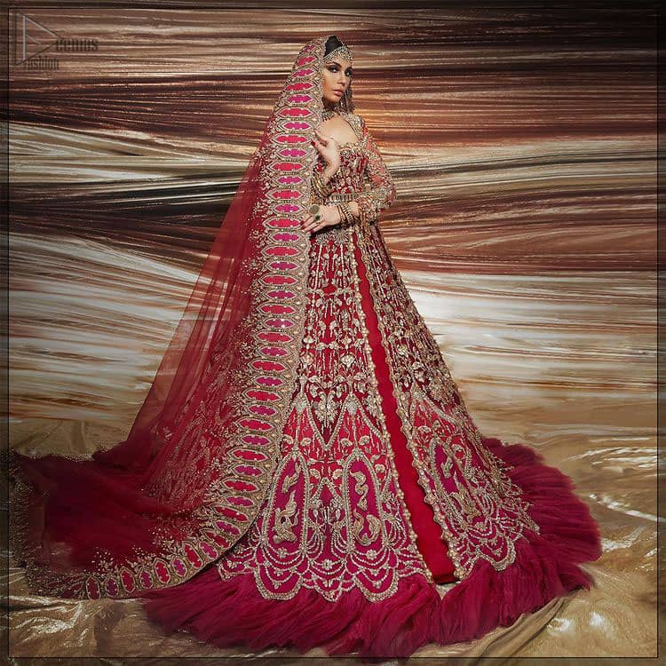 A bride wants to feel as beautiful as she is on her special day, and knowing that our Lehenga was the final decision in that, it is priceless. This bold and iconic bridal ensemble with its dainty flutter silhouette leaves us feeling whimsical, romantic, and even a bit enchanted. This front open pishwas is laden with silver and golden zardozi work, a beautifully crafted waist belt and floral embroidery patterns. The dress is even more enhanced with the ruffled bottom. It is coordinated with a beautiful dupatta with thick matha Patti borders along the length and an intricate beautiful border on the rest of the two sides.