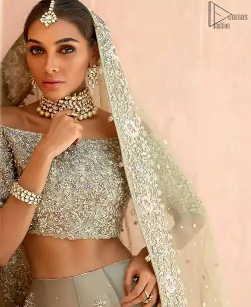 When extreme beauty is your identity, the Olive Green Off Shoulder Blouse Lehenga makes sure it boosts your gorgeousness with