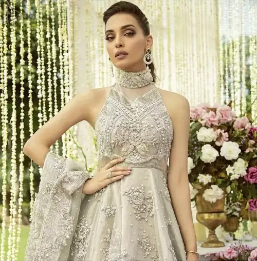 Drape yourself to perfection for the classiest affair in this flattering pastel green ensemble festooned with intricate zardozi hand embroidery