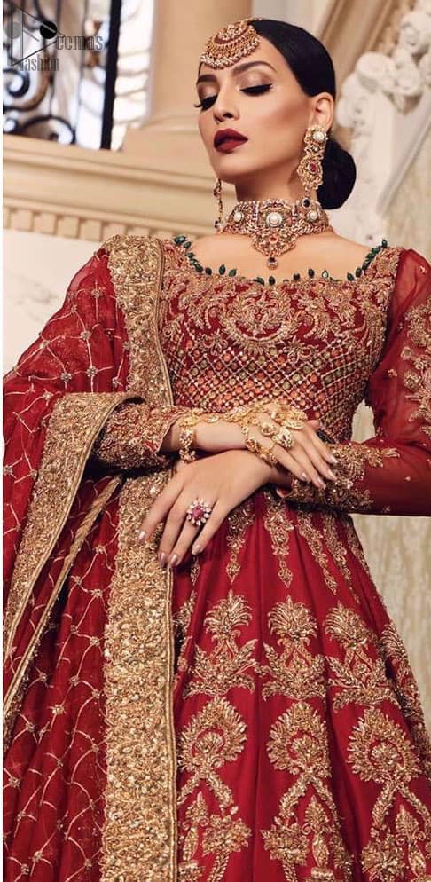 Poise, Beauty, and Charm. Feel pampered in this finely handcrafted celestial-inspired ensemble, deftly ornamented with intricate hand-embroidery. Fitted red blouse with cross-check pattern work and solid embroidery. Pakistani bridal dress comes with a large flare lehenga having multiple panelled embroideries. Pure Organza dupatta has heavy four-sided borders and cross-checks pattern embroidery.