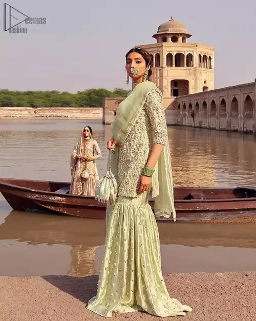 Glow up an evening formal event with a Light Parrot Green Gharara Shirt, a beautiful three-quartered sleeves shirt designed with