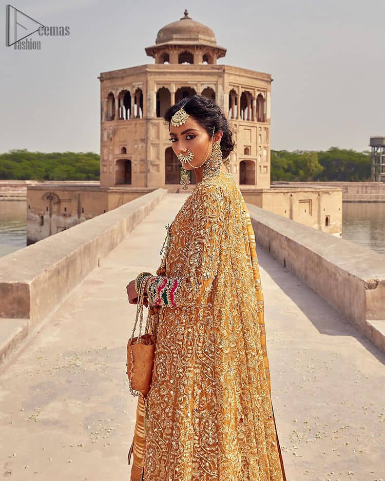 Presenting the Mustard Angrakha Frock, a charming Mehndi wear that will enhance your stunning personality to a whole new level. Made with pure organza, this mustard-coloured, full-sleeved frock comes with a graceful Chatta Patti Dupatta that perfects your looks. 