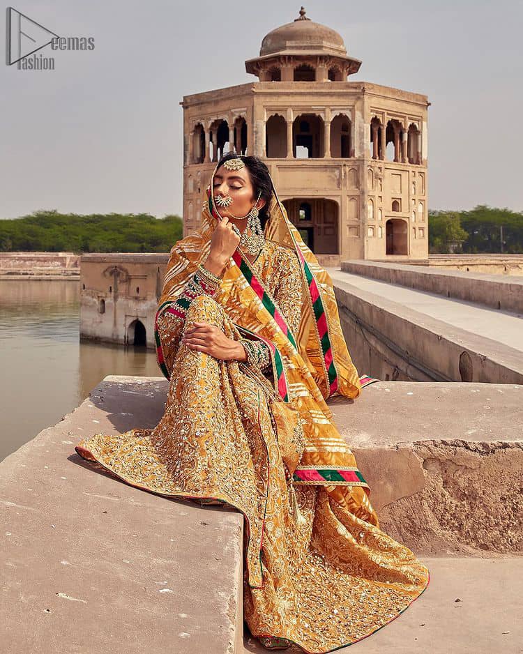 Presenting the Mustard Angrakha Frock, a charming Mehndi wear that will enhance your stunning personality to a whole new level. Made with pure organza, this mustard-coloured, full-sleeved frock comes with a graceful Chatta Patti Dupatta that perfects your looks. A beautiful touch of light golden embroidery embellished