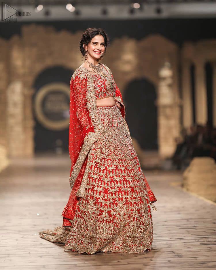 Pakistani Wedding Wear having Red Short Blouse Lehenga. Introducing a red blouse and lehenga to our wide range of charming bridal dresses.