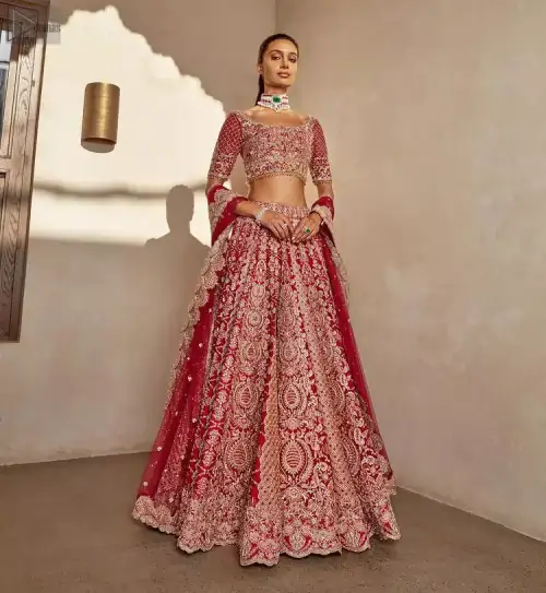 It's all about looking stunning with a gorgeous Red Lehenga Blouse on your big day. Made with pure organza, this