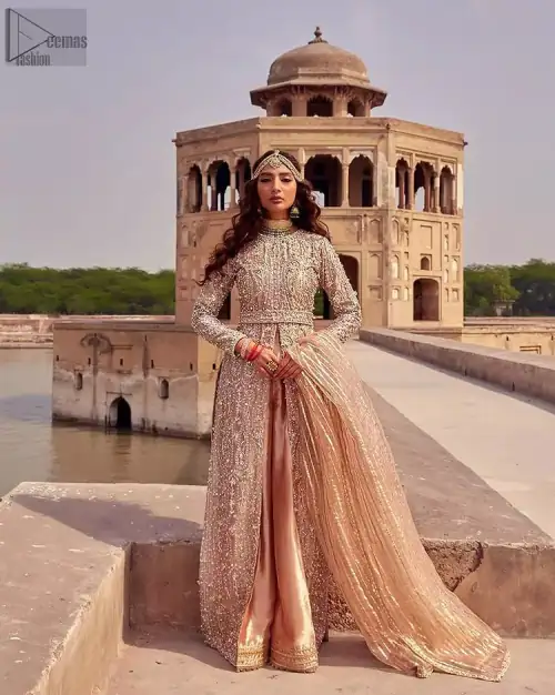 the dress with a tissue dupatta and graceful palazzo pants makes you the center of attention on your big day. Peach