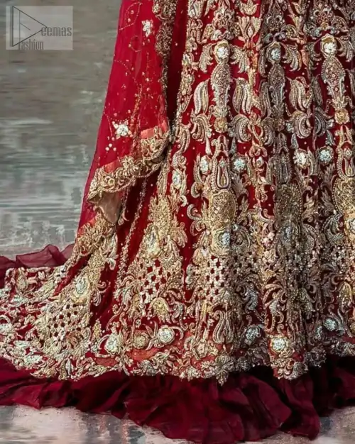 Red Ruffled Back Train Lehenga Blouse – Dupatta. A red half-sleeved traditional Blouse Choli that is exceptionally made with pure