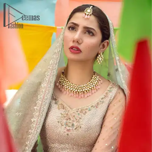 Talking about traditional, Deemas Fashion introduces the Aqua Lehenga and pink blouse which is an outstanding upgrade to bridal wear.