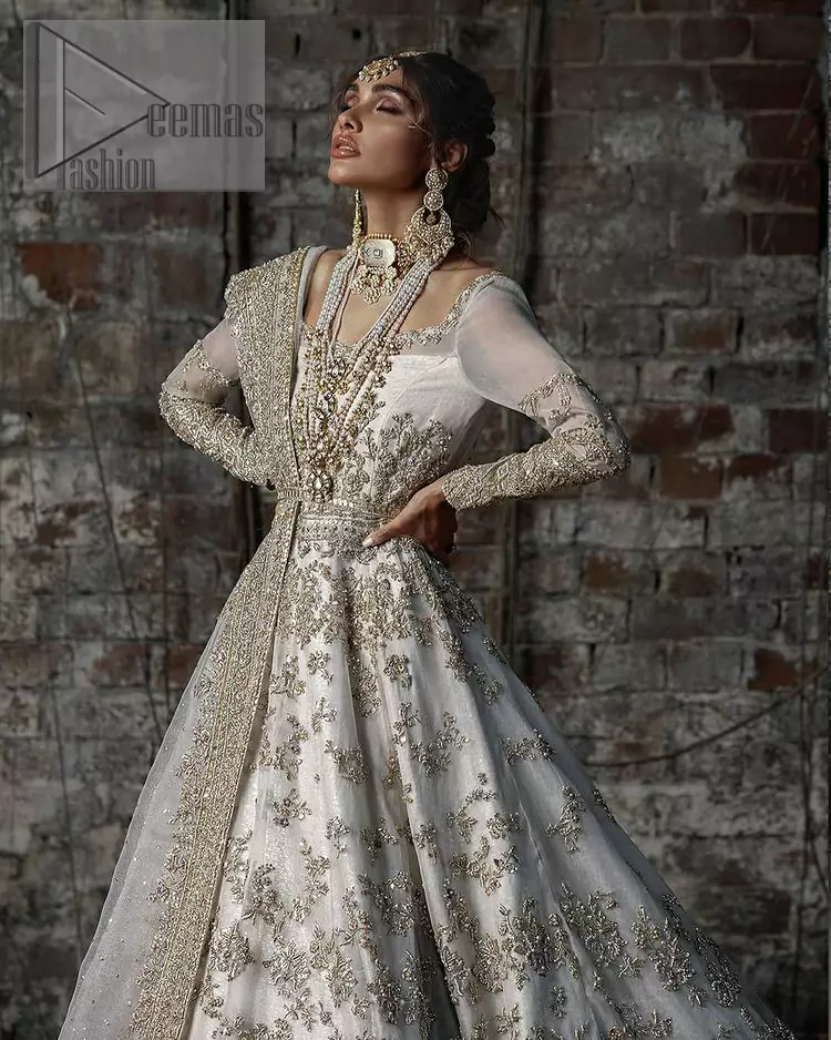 Back train is a dreamy silhouette designed to highlight you like the dazzling jewel on your walima day. The back train of ivory white maxi is beautifully embellished with silver and golden embroidery which includes kora, dabka, and sequins work. Further, it is prominent with full sleeves and boat shape neckline just to enhance the attractiveness of this ivory white maxi. It is paired up with the same colour dupatta that is adorned with a four-sided embellished border and combined with sequins spray all over just to complete your dreamy look on your Walima. 