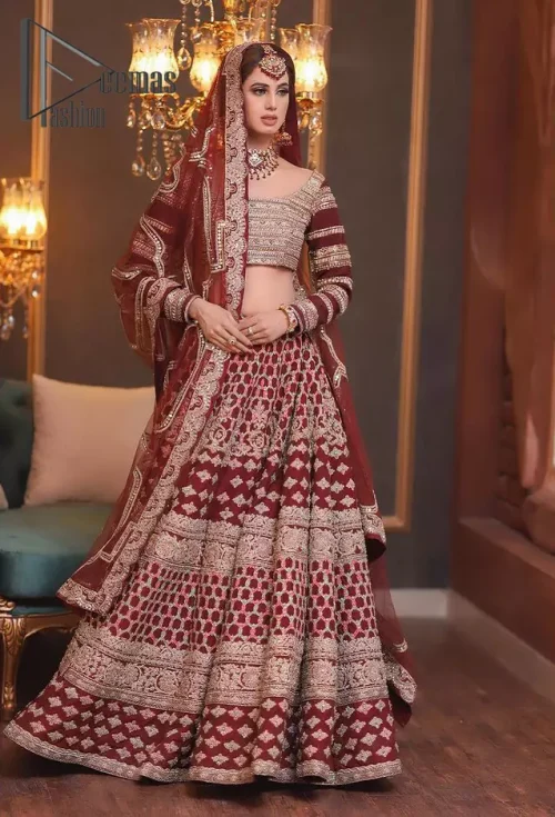 Attain your expectations on your big day with this dress. The classically vibrant combination of red and gold is a