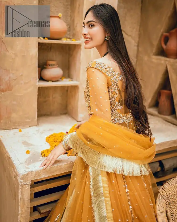 Mustard is just associated and boosts your Mehandi. Presenting a dreamy mustard frock with a heavily embroidered bodice on a